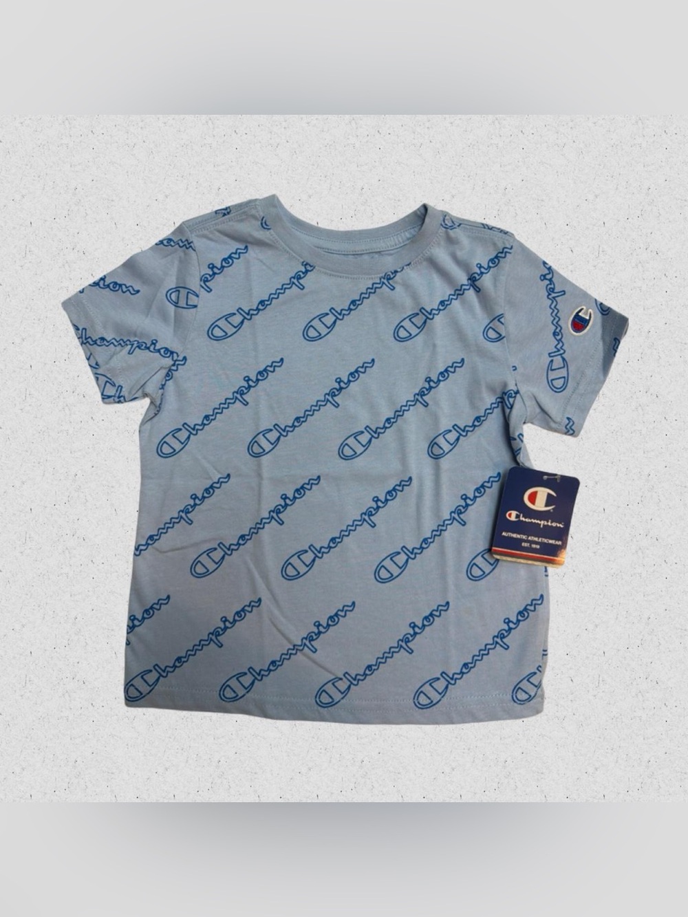 Champion Boy’s Light Blue Tee with Navy Allover Logo